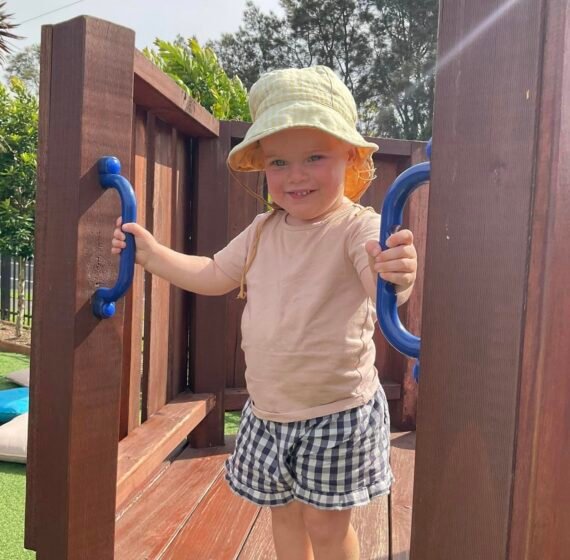 Kid is happy while playing in the park {{brizy_dc_image_alt imageSrc=